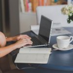 person using black and silver laptop computer